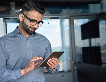 man working on an iPad