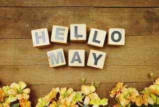 Hello May words and yellow flowers